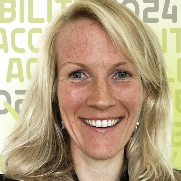 Headshot of Anne Logan smiling against a white background