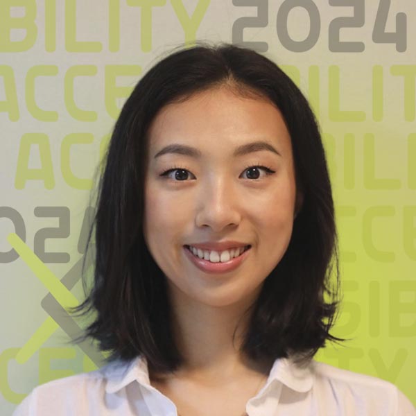 Headshot of Miranda smiling against a clear white background