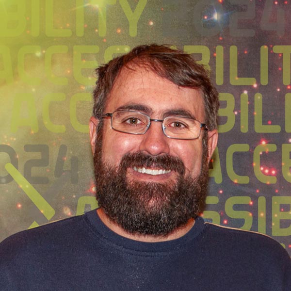 Headshot of Scott wearing glasses and smiling against a background image of a galaxy